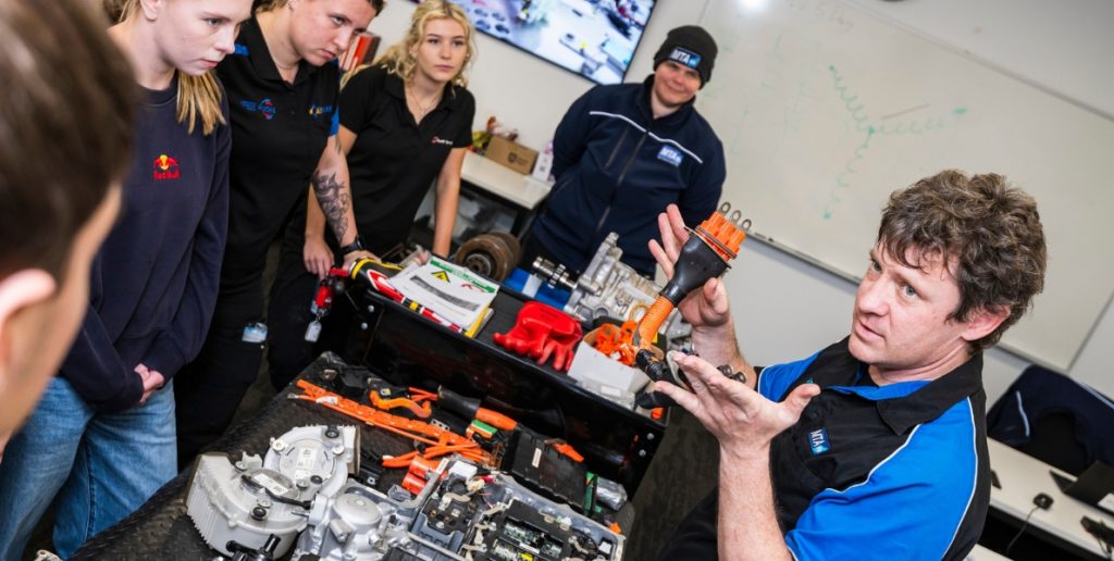 MTA WA trainer Jared demonstrating EV components to apprentices during hands-on electric vehicle training at Balcatta.