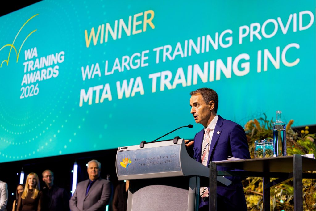 MTA WA Group CEO speaking at the lectern following the 2026 Large Training Provider of the Year award presentation