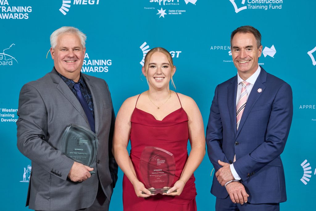 Three attendees pictured with awards at the 2026 WA Training Awards.
